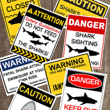 Load image into Gallery viewer, Decorate your Jaws Party with these fun shark decorative signs. You will receive a PDF file formatted 8 ½ X 11inches with 8 different Shark Warning Signs. Two of the signs can be edited with your child's name. 
