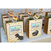 Load image into Gallery viewer, Personalized Favor Bags to fill up with goodies and treats for your Dinosaur Party. These bags come in two sizes and include personalized tags to add your guest names or child name.
