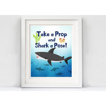 Load image into Gallery viewer, These jaw-some photo props will surely bring fun to your Shark Party Theme. You will receive a PDF file formatted on 8 ½" X 11" with 8 different Shark Photo Props. It also includes "Take a Prop Shark a Pose" Sign. Print as many copies as you desire then paste on dowel sticks.